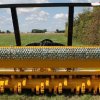 REVIEW OF THE DESIGN OF A MOUNTED ROTARY SHREDDING MULCHER FOR VEGETATION REMOVAL